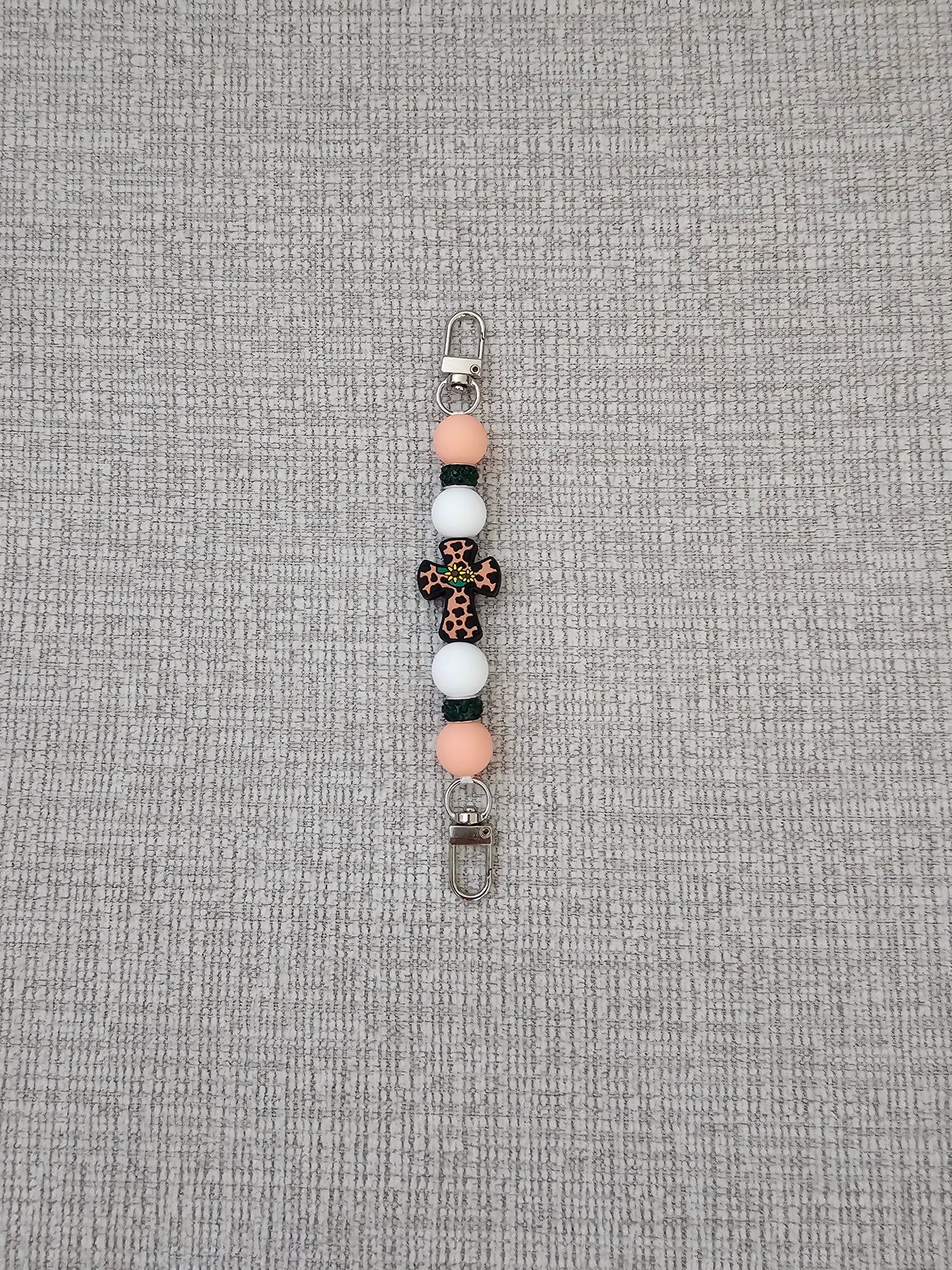 Phone Hand Strap/ Kindle Strap/ iPad Strap Interchangeable - Silicone Beaded Strap Peach/White Cross Focal with Green Rhinestones