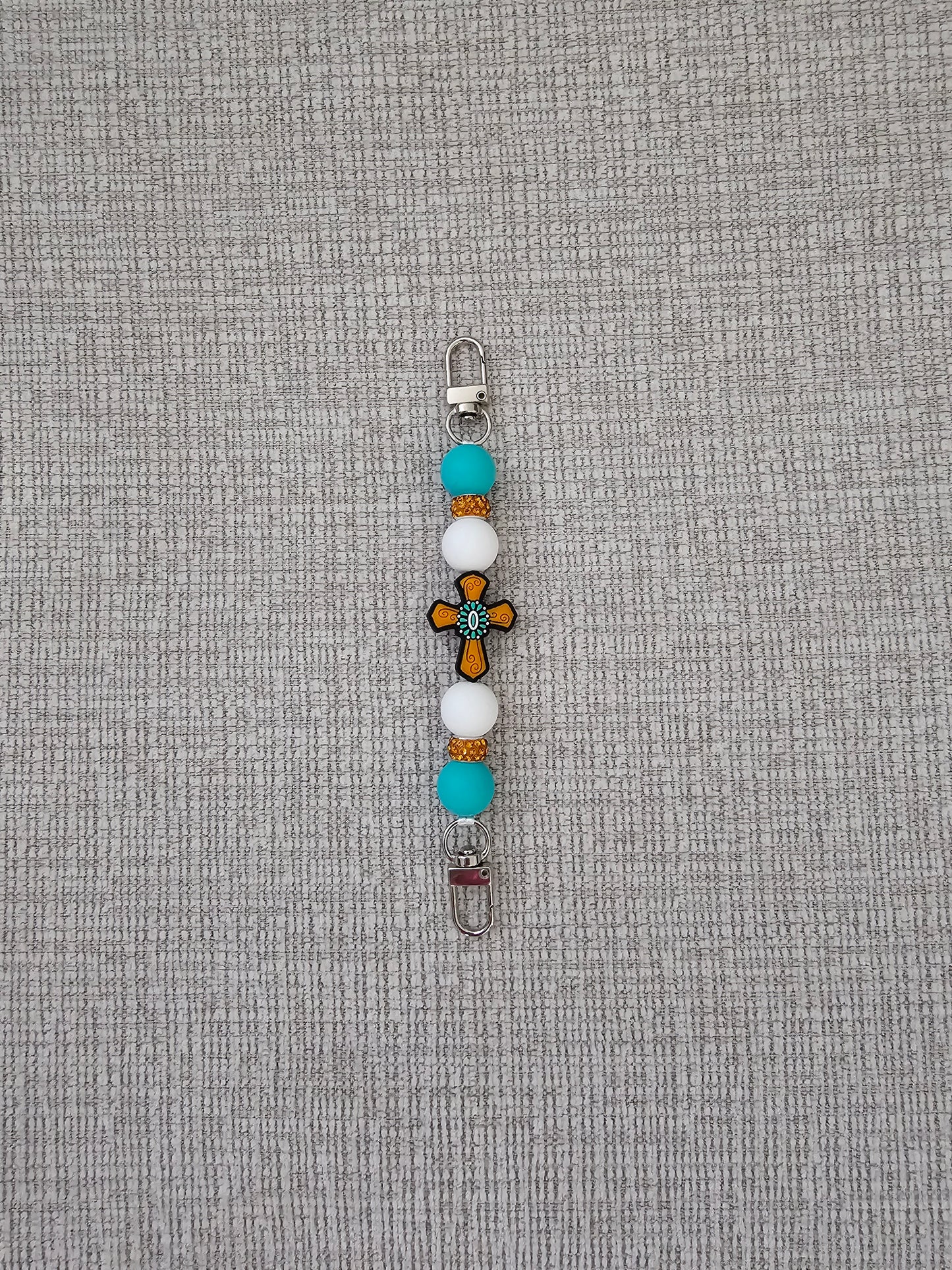 Phone Hand Strap/ Kindle Strap/ iPad Strap Interchangeable - Silicone Beaded Strap Cross Focal with Teal Blue/White Beads & Orange Rhinestones