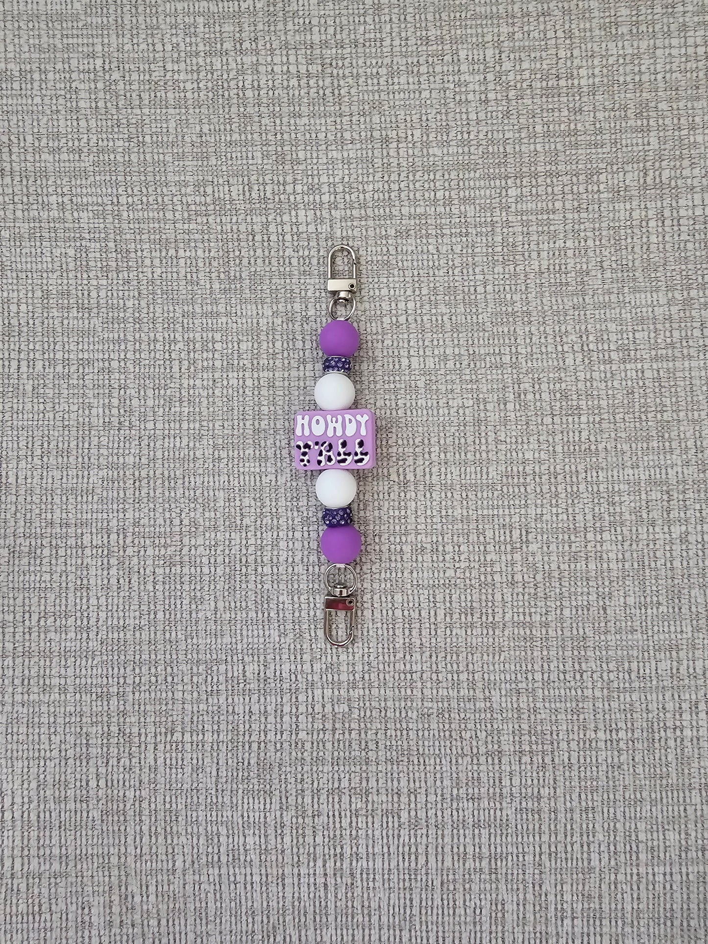 Phone Hand Strap/ Kindle Strap/ iPad Strap Interchangeable - Silicone Beaded Phone Strap with Howdy Ya'll Focal with Purple/White Beads & Purple Rhinestones